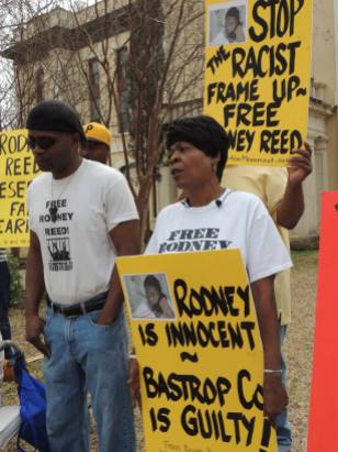 Rodney's mother, Sandra Reed, and his brother, Rodrick Reed, demonstrate outside the Bastrop Co. Courthouse